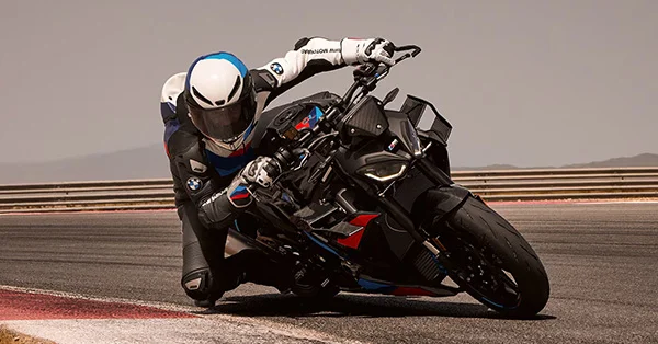 2026 BMW M 1000 R leaned aggressively through a track-style corner